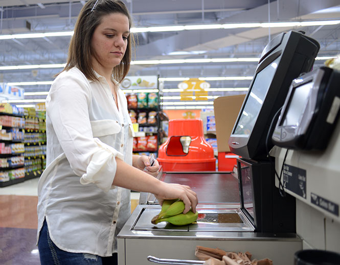 Jennifer Jones purchases bananas at Acme in Kent Tuesday Jan. 14, 2014. Jones kept a resolution from December 2012 to become and stay vegan