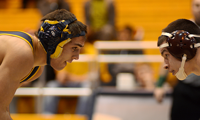 Tyler Small, Junior from Kent State, faces off with Zach Horan, sophomore from Central Michigan, during the match Sunday, Jan. 26, 2014.