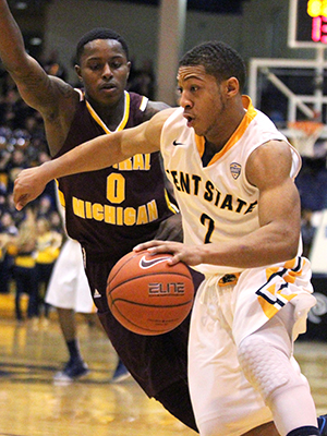 Sophomore guard Kellon Thomas defends the ball from Central Michigans Braylon Rayson  Saturday, Feb. 15, 2014. The Flashes won the game 83-75.