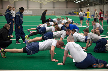 Sophomore cadets in the Air Force ROTC take the Physical Fitness Test Friday, Feb. 7, 2014. Cadets have one minute to do as many push ups as they can while another cadet counts.