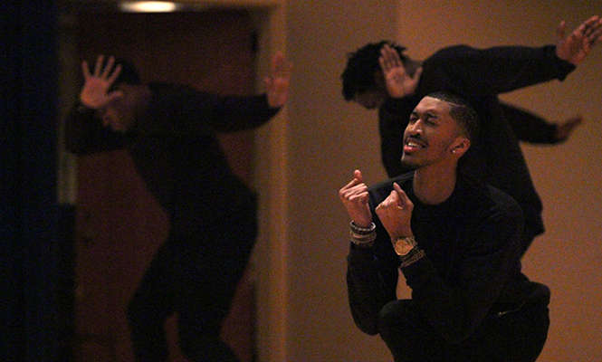 Jordan Pugh, a member from the dance group Fluidity, performs at the All Black Showcase in the Kiva Thursday, Feb. 20, 2014.