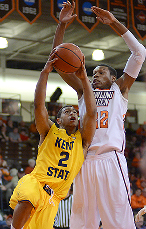 Kent State sophomore guard Kellon Thomas drives to the basket past Bowling Green junior forward Richaun Holmes, at the Stroh Center in Bowling Green, Wednesday evening, Feb. 26, 2014. Kent State fell to the Falcons, 73-6.