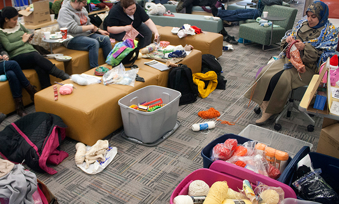 The biannual Knit-a-Thon was hosted by the organization Knitting for Those in Need on the fourth floor of the Kent State University  library Friday, Feb.28, 2014. The organization donates hats and scarves to those in need.