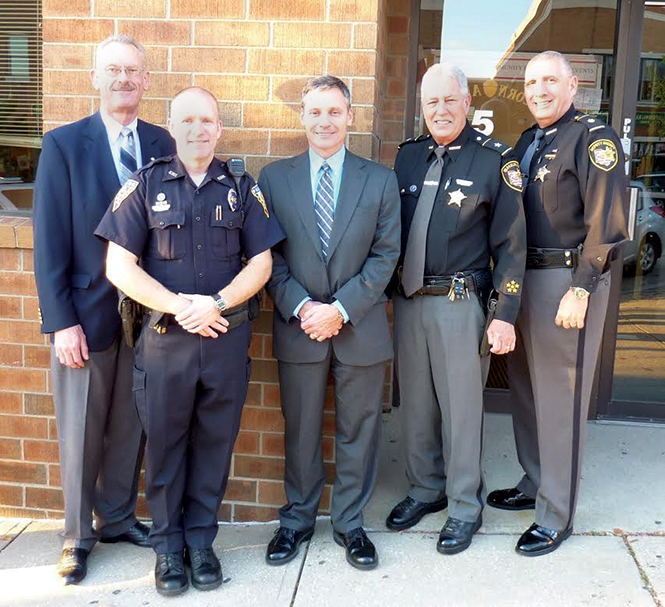 Pictured from left to right are Mental Health and Recovery Board of Portage County Chairman William Nome; Kent State Police Officer Will Scritchfield, who is a 2013 Crisis Intervention Team Officer of the Year; Kent State Assistant Police Chief Dean Tondiglia; Major Dennis Missimi of the Portage County Sheriff’s Office; and Portage County Sheriff David Doak.