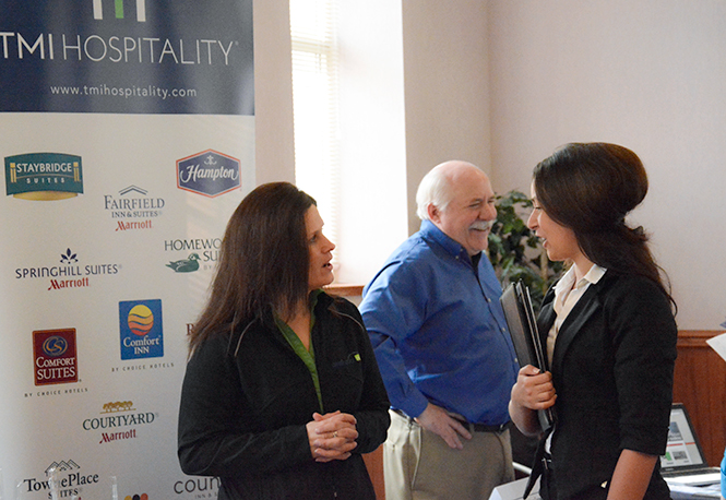 Students interact with business professionals at the second annual Hospitality Management Career Fair, Monday, March 10, 2014, at the Moulton Hall Ballroom.