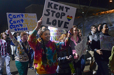 Kent State LGBTQ activists walk the Esplanade from the student center to front campus with pro-equality signs to rally against Westboro Baptist Church who planned to picket Kent State Wednesday, Feb. 19, 2014.