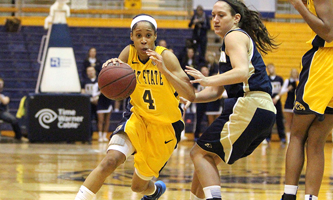 Kent State University guard Amber Dunlap protects the ball in a game against the University of Akron on Sunday, March 2, 2014. Kent State lost 66-80.