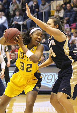 Kent State University forward Montia Johnson protects the ball from Akron University, March 2, 2014. Kent State played their final game of the season, Monday, March 10, 2014, at Ball State, with a losing score of 73-38.