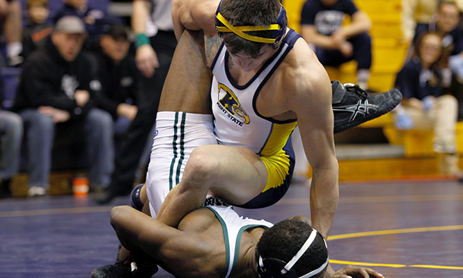 Kent States Michael DePalma faces his final opponent at his match at the 2014 MAC Championship wrestling meet Sunday, March 8, 2014 in the M.A.C. Center. DePalmas final defeat against an Ohio University player won him third place in his weight class.