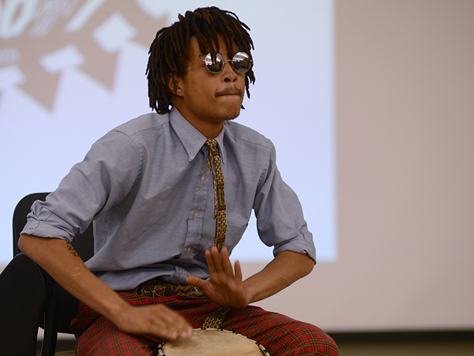 Pan-African studies senior Damien McClendon presents his piece Theres a Railroad at the Bottom of the Atlantic Ocean Made of Human Bones at the 3rd semi-annual Under The Baobab Tree talent showcase Thursday, April 10, 2014.