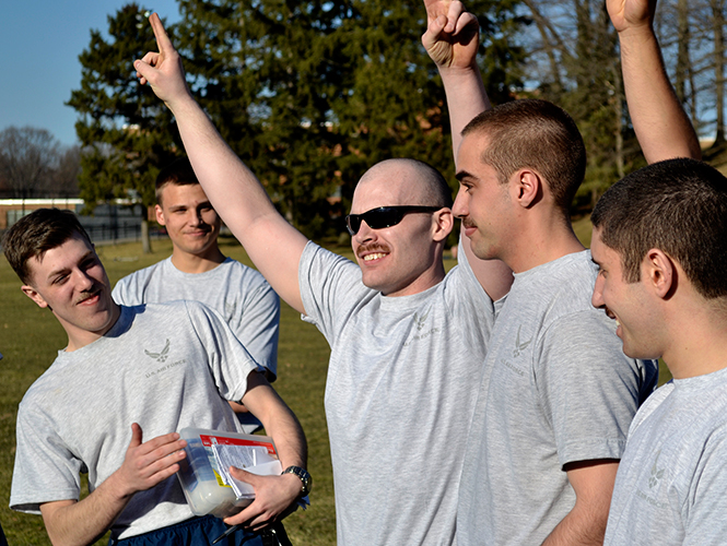 Senior+Jerrod+Mertz+celebrates+after+the+airforce+ROTC+cadets+vote+him+the+winner+of+their+mustache+march+competion+Tuesday%2C+April+1%2C+2014+outside+Taylor+Hall.