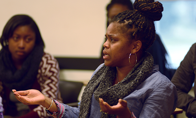 Savanna Mccarthy, a freshman student in Traci Williams Black Images class at Kent State University participates in a discussion on how the gun shot on campus last night was handled on April 3, 2014.