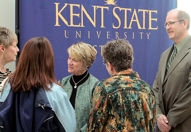 Kent State Universitys president-elect Beverly Warren (center) and Kent State-Stark Dean Walter F. Wagor (right) talk with students and faculty at the meet and greet reception held at the Stark campus, Thursday, Apr. 24, 2014, to welcome Warren.