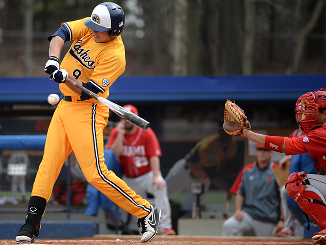 Sophomore infielder Zarley Zalewski makes contact with a pitch at the game against Miami University Sunday, April 13, 2014. The Flashes played a three game tournament winning two out of the three games.