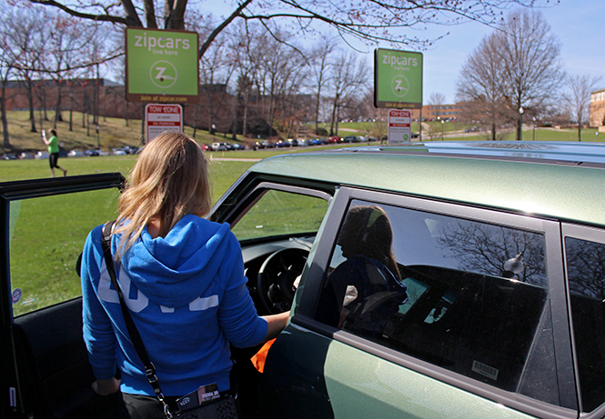 Kent State freshman Julia Schoonover gets in a Zipcar she rented on April 17, 2014. There are Zipcars located in the R-6 Fletcher lot by Terrace Hall, available for rental online.