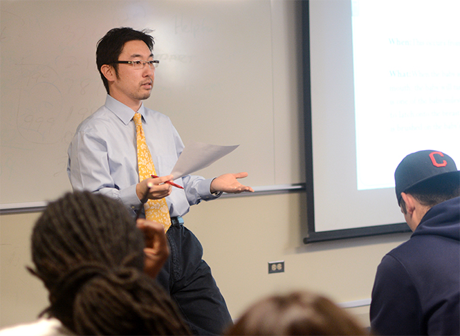 Assistant physical education professor Takahiro Sato teaches a class in the M.A.C. Annex, Thursday, April 10, 2014.