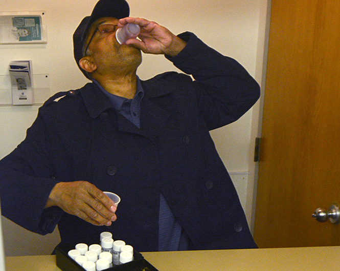 Johnny Bable takes his dosage of Methadone, a prescription painkiller, at Community Health Centers Methadone Clinic in Akron Thursday, April 17th, 2014.