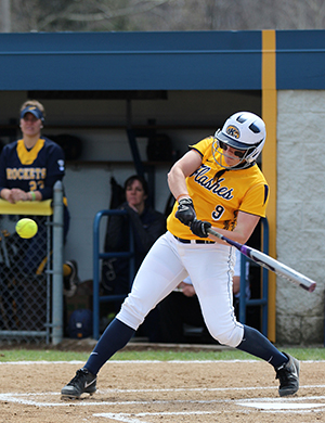 Kent State infielder Maddy Grimm hits a home run in the first game of a douvle header against Toledo, April 18, 2014. The Flashes won 13-0 the first game and 1-0 the second game.