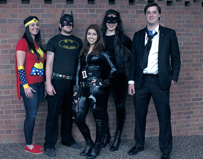 From left, junior philosophy major Tammy Thompson as Wonder Woman, sophmore psychology major Mike Scritchfield as Batman, Elizabeth Ross as Catwoman, Madelyn Tormasi as Black Widow and senior philosophy major Scott Finel as Superman dress as a favorite character at the DC vs. Marvel Comics debate Thursday, April 17,2014 in the main hall auditorium at Kent State-Stark.