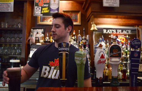 Rays bartender Angelo Cataldo, junior exercise science major, pours a draft in downtown Kent, Tuesday night, April 8, 2014.