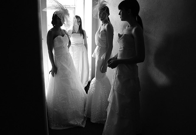 Models wearing a collection of student-made wedding gowns wait backstage during last springs Kent Fashion Week showcase at 157 Lounge in Kent, Ohio on May 4, 2013.