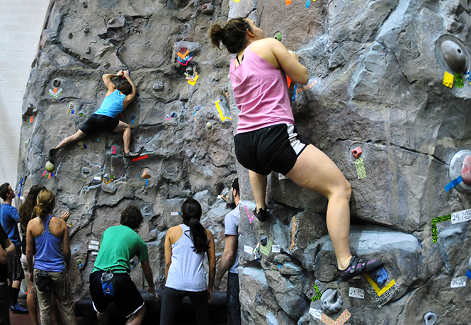 Students climb the rock wall at the Rec