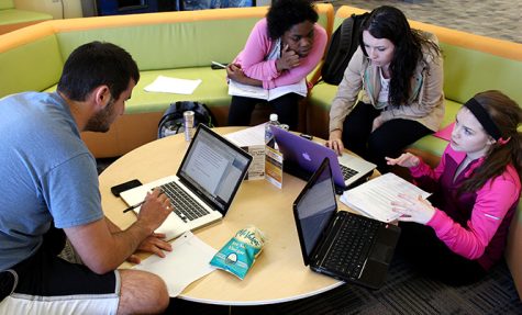 (From left) Jake Mcclellan , Kalia Powers, Kaitlyn Thissen and Rachael Kobalchin work on a class project during a study session in the library, April 8, 2014.