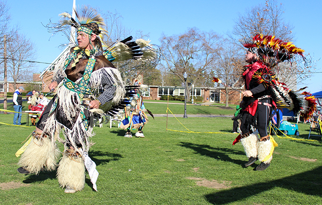 Roy Bailey (left) and Dustin Mayfield (right) dance at the Native American Pow Wow hosted by the Native American Student Association Saturday, April 26, 2014.