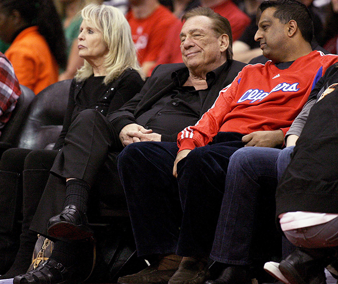Donald Sterling, center, owner of the Los Angeles Clippers, watches the Clipper game against the Boston Celtics at Staples Center in Los Angeles, February 26, 2011. Sterling was banned from the NBA and fined $2.5 million Tuesday, April 29, 2014 after being recorded saying racist comments toward African Americans. (Gary Friedman/Los Angeles/MCT)