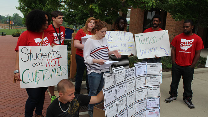 Members of the Ohio Student Association stand in Risman Plaza to protest the tuition increase. 