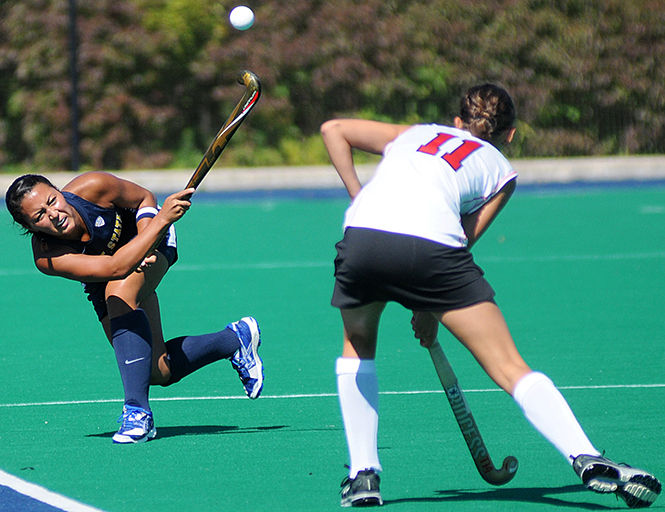Sophomore midfielder Alayna Harris makes a pass at the field hockey game against Ohio State on Tuesday, Sept. 24, 2013. The Flashes lost 3-4.