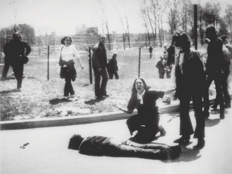 Mary Ann Vecchio gestures and screams as she kneels by the body of a student lying face down on the campus of Kent State University, Kent, Ohio on May 4, 1970.