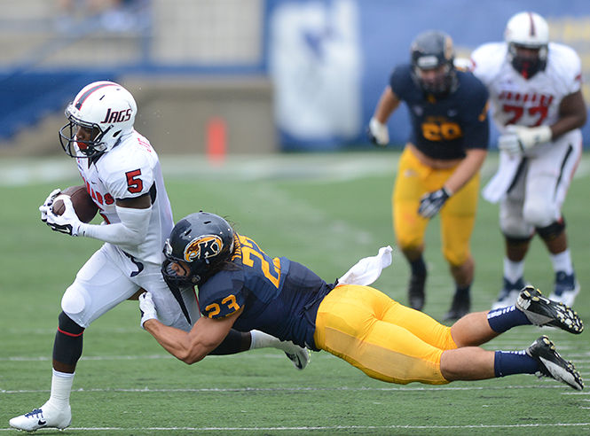 Junior safety Jordan Italiano attempts to take down South Alabamas Jeremé Jones inthe game against the University of South Alabama on Saturday, Sept. 6, 2014.