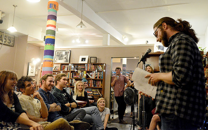 Sam+Chronister%2C+junior+psychology+major%2C+reads+his+poetry+at+Scribbles+on+Saturday+night%2C+Sept.+20%2C+2014.+Scribbles+is+now+hosting+a+poetry+night+once+a+month.