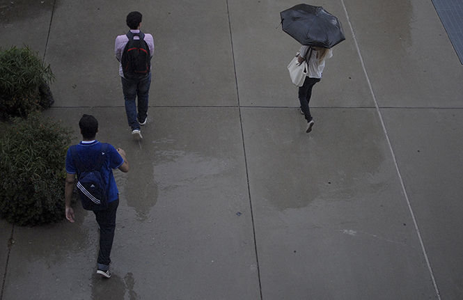 Students walk to classes in the rain Tuesday, Sept. 2, 2014.
