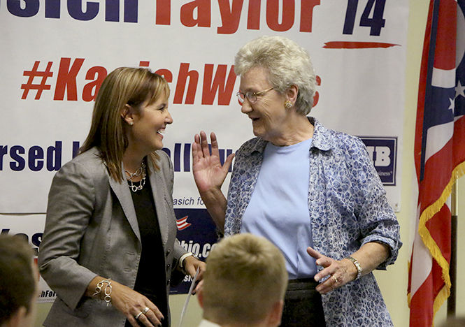 Lieutenant Governor Mary Taylor greets Janet Esposito at the Lieutenant Governors Luncheon on Sept. 8, 2014.