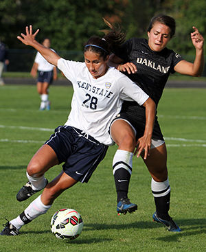 Kent States Brittany Maisano blocks the opponent from stealing the ball during a game against Oakland Friday, Sept. 19, 2014. The teams tied the game 1-1 in double overtime.