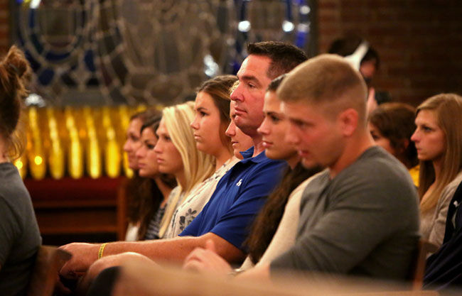 Randy Bitsko, father of Jason Bitsko, watches a speaker at the memorial service held his son’s honor in the Newman Center on Wendesday, Sept. 10, 2014. Jason Bitsko passed away suddenly two weeks prior to the beginning of the Fall season.