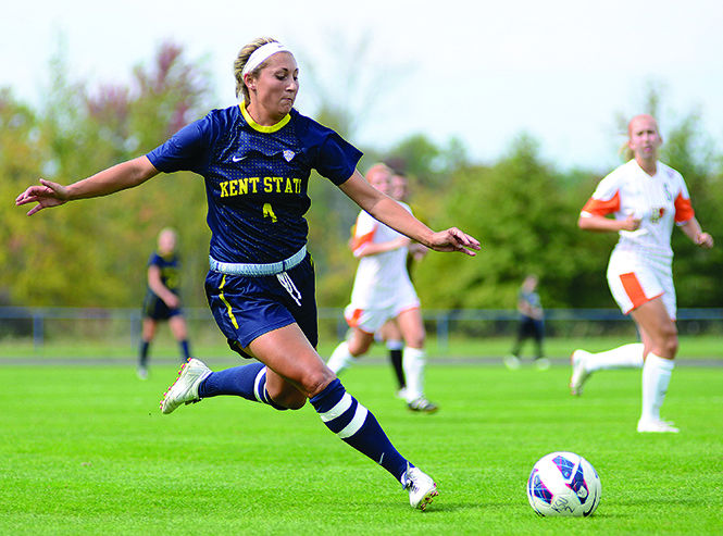 Senior forward Jessacca Gironda drives the ball for Kent State on Sept. 29, 2013, against Bowling Green. Gironda scored her season high of three goals, leading the Flashes to a winning score of 5-1.
