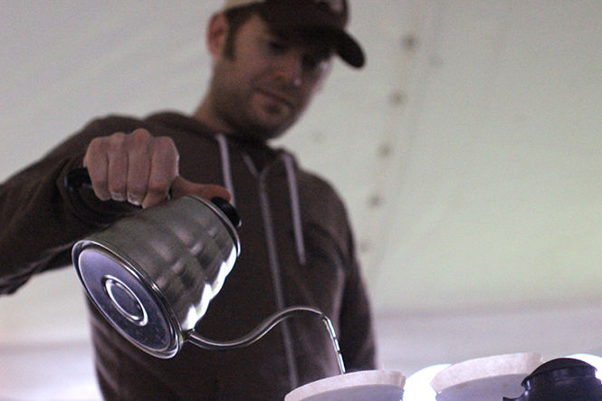 Mike Mistur from Bent Tree Coffee Roasters makes coffee at the second annual Nuts About Coffee event outside the Williamson Alumni Center on Thursday, October 16, 2014. Participants tasted coffee samples from coffee shops in Kent, and the shop with the best score received the Best Coffee in Kent award.