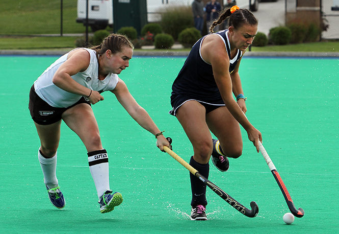 Kent+States+Hannah+Faulkner+rushes+the+ball+down+the+field+during+a+match+against+Ohio+University+Saturday%2C+Oct.+11%2C+2014.+The+Flashes+won%2C+4-3.