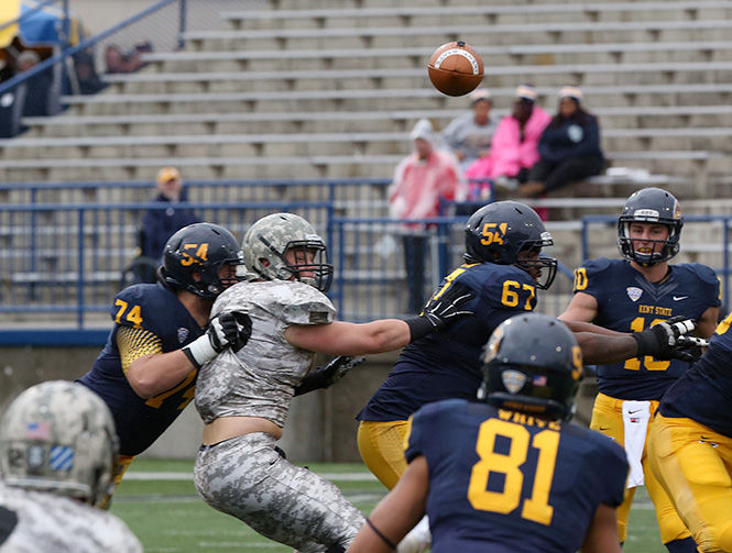 Quarterback Colin Reardon attempts to complete a pass at the Homecoming game against Army on Saturday, Oct. 18, 2014. The Flashes faced the University of Miami of Ohio this past weekend and lost, 3-10.