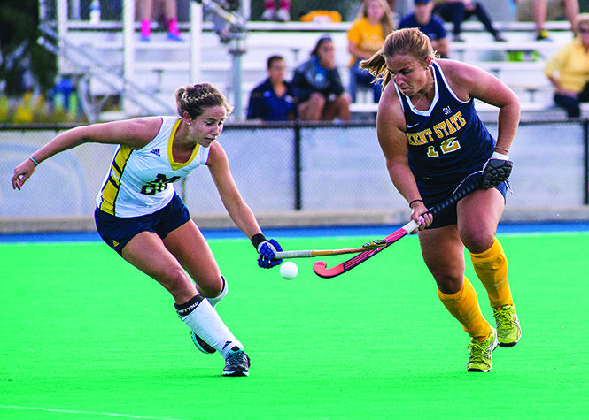 Kent States senior midfielder Julia Hofmann fights for possession of the ball in the game against the University of Michigan Sunday, Sept 21, 2014. The Flashes lost 3-2.