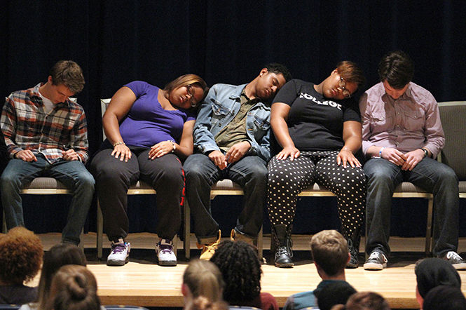 A group of student volunteers are hypnotized into a deep sleep during Chuck Kings Culture Shock program in the Kiva Wednesday, Oct. 1, 2014. King hypnotized the students to act differently than their race or ethnicity and put them in different scenarios.