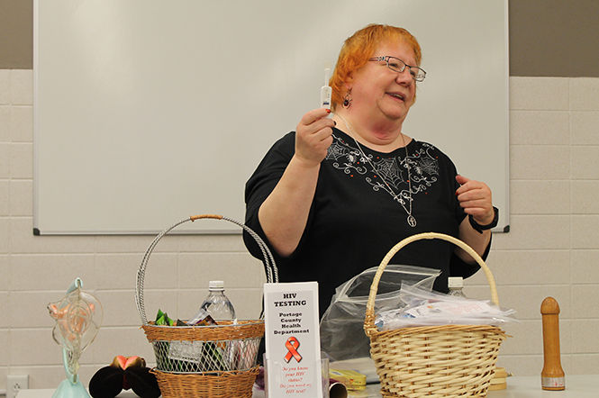 Kat Holtz, health educator and HIV specialist, teaches Kent State students about contraceptives and practicing safe sex at the latexology presentation as a part of Sex Week on Monday, Oct. 27, 2014.