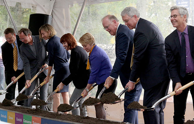 Despite bad weather, President Warren amongst others, break ground to start the construction of the new architecture building Friday, Oct. 3, 2014.