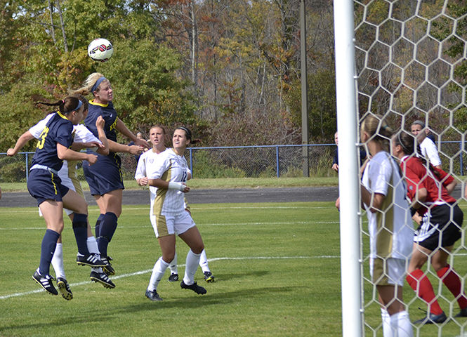 Junior midfielder Madison Helterbran attempts to score during the game against the University of Akron on Sunday, September 28, 2014. The Flashes won against the Zips 3-0.