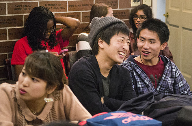 Toshiki Nakamura, a freshman English as a Second Language major from Japan, laughs with friends in the Kent State International Mentors program before KSIMs India night in the Williamson Alumni Center on Tuesday, Sept. 30, 2014.