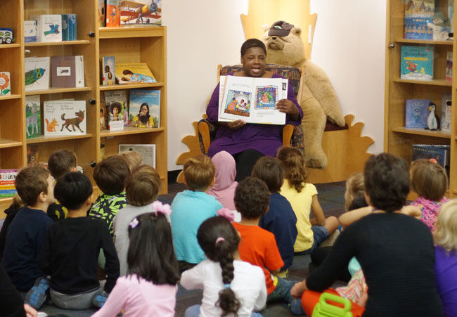 Award-winning author Angela Johnson reads to the Kent State Child Development Center’s kindergarten class in the Reinberger Childrens Library on Thursday, Oct. 2, 2014.