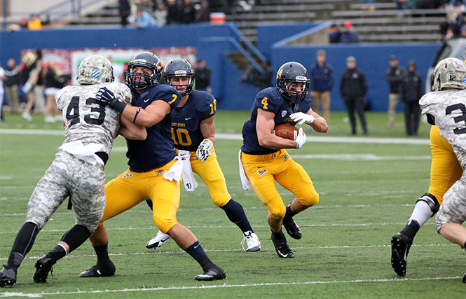 Sophomore running back Nick Holley runs the ball through Army defense during the Homecoming football game at Dix Stadium on October 18, 2014. The Flashes went on to win, 39-17.